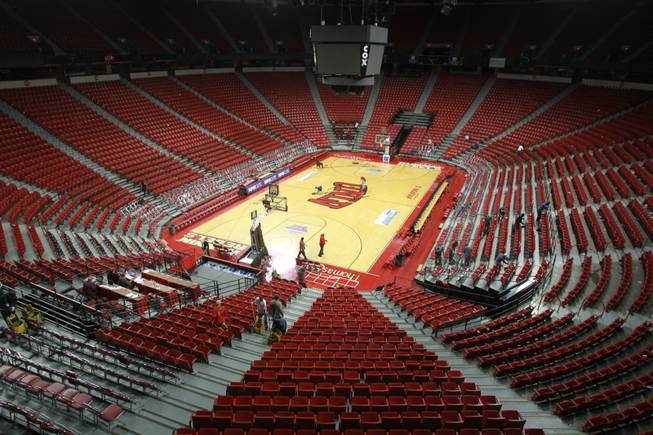 Clean up crews prepare the Thomas & Mack for its hosting of the National Finals Rodeo Dec. 1, 2012. 